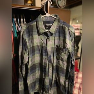 Green button down shirt.